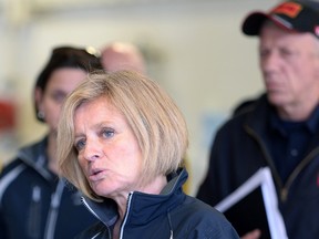 Alberta Premier Rachel Notley, left, speaks at the Fort McMurray fire department as fire chief Darby Allen looks on in Fort McMurray, Alta., on Monday, May 9, 2016. THE CANADIAN PRESS/Jonathan Hayward