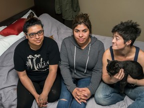 From left: Marbel Toledo, Tita Cool and Allie Pattie roomed together in Fort McMurray before the wildfires forced them to leave their home. The three women try and cope with the tragedy that has befallen them, while temporarily staying in one of the 40 rooms that Microtel Inn and Suites in Whitecourt has donated to Fort McMurray evacuees on Thursday May 5, 2016.