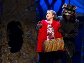 Little Red Riding Hood, played by Chloe Patrick, is charmed by the wolf, played by Mika Little, in the Catholic Central secondary school production of Into The Woods. (CRAIG GLOVER, The London Free Press)