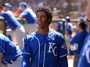 Kansas City Royals shortstop Raul Mondesi (27) looks on form the dugout during the sixth inning against the Texas Rangers at Surprise Stadium. (Jake Roth/USA TODAY Sports)