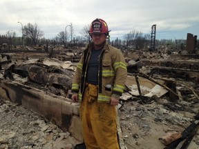 For firefighter Mark Stephenson, shown in this handout image, the Alberta oilsands capital is his home and he plans to rebuild on the same spot where his house went up in flames. "I'm not leaving Fort McMurray. I'm a Fort McMurray firefighter," Stephenson said Tuesday while helping clean up one of the city's fire halls. THE CANADIAN PRESS/HO