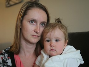 Megan Bradshaw holds her 14 month old daughter Kennedy in Winnipeg, Man. Tuesday May 10, 2016. Bradshaw had her cameras and computer equipment containing her wedding and daughter's baby pictures stolen.