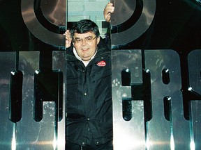 Terry Jones pokes his head through the iconic doors of the Oilers former locker-room at Rexall Place. (File)