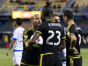 Columbus Crew forwards Federico Higuain (left) and Kei Kamara argue over who would take a penalty kick against Montreal on Saturday. Higuain eventually scored on the PK, but Kamara has been suspended for comments made after the game. (USA TODAY SPORTS)