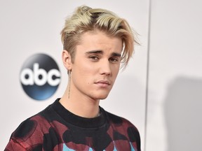 In this Sunday, Nov. 22, 2015 file photo, Justin Bieber arrives at the American Music Awards at the Microsoft Theater in Los Angeles. (Photo by Jordan Strauss/Invision/AP, File)