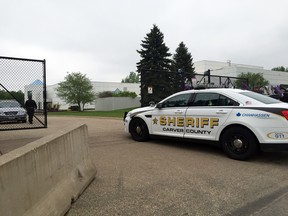 A Carver County sheriff’s vehicle enters through the gates of Prince's Paisley Park home and studio in Chanhassen, Minn., Tuesday, May 10, 2016. A Minnesota doctor saw Prince twice in the month before his death, including the day before he died, and prescribed him medication, according to contents of a search warrant that were revealed Tuesday even as authorities revisited the musician's estate. (AP Photo/Amy Forliti)