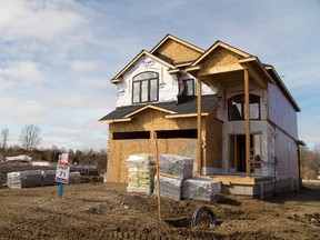 The city is considering charging a "growth fee" to people building new homes. (Postmedia Network file photo)
