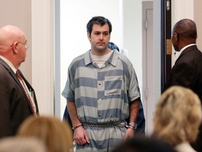 In a Sept. 10, 2015 file photo, former North Charleston police officer Michael Slager, is lead into court, in Charleston, S.C. A federal judge will decide whether Slager, charged with murder in the shooting death of an unarmed black motorist, can remain free on bond. An indictment unsealed Wednesday, May 11, 2016, shows that Slager is charged with violating Walter Scott's civil rights and two other federal charges. (Grace Beahm/The Post And Courier via AP)