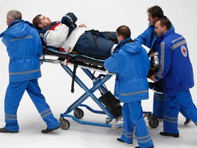 Paramedics evacuate Slovakia's Michal Sersen as he was injured during a game against Belarus at the world hockey championship in St. Petersburg, Russia, on Wednesday, May 11, 2016. (Dmitri Lovetsky/AP Photo)