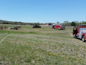 Keene Fire Department tweeted this photo of firefighters at the scene of a small plane crash after it struck a deer and flipped over while trying to land at a New Hampshire airport. (KeeneFire/Twitter)
