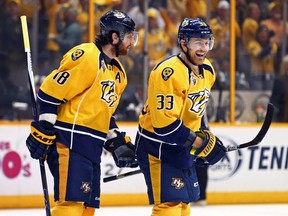 Predators centre Colin Wilson (33) reacts with teammate left wing James Neal (18) after scorning a goal against the Sharks during the third period in Game 6 of the second round of the NHL playoffs in Nashville on Monday, May 9, 2016. (Aaron Doster/USA TODAY Sports)