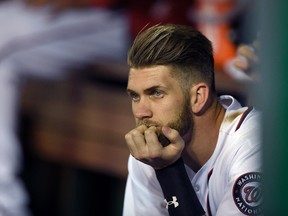 Washington Nationals' Bryce Harper looks on from the dugout during the eighth inning of an interleague baseball game against the Detroit Tigers, Tuesday, May 10, 2016, in Washington. The Tigers won 5-4.(AP Photo/Nick Wass)
