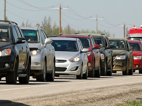 Evacuees from Fort McMurray, Alberta southbound on Highway 63 after fleeing an out of control wildfire that forced the evacuation of Fort McMurray, Alberta, the fourth largest city in Alberta. Over 80,000 resident of the northern Alberta city were evacuated as fire threatened to consume the city. A provincial state of emergency has been declared in Alberta. (PHOTO BY LARRY WONG/POSTMEDIA NETWORK)