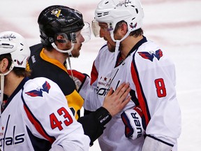 Pittsburgh Penguins' Sidney Crosby and Washington Capitals' Alex Ovechkin meet in the handshake line after the Penguins eliminate the Capitals from the NHL playoffs in Pittsburgh on May 10, 2016. (AP Photo/Gene J. Puskar)