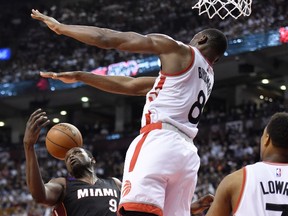 Toronto Raptors forward Bismack Biyombo stops Miami Heat forward Luol Deng during second-half NBA playoff action at the Air Canada Centre in Toronto on May 11, 2016. (THE CANADIAN PRESS/Frank Gunn)