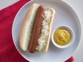 Rogers Place F&B general manager Eric Bayne has been challenged to ensure the hot dogs at the new arena are as good as the ones that OEG v.p. Bob Nicholson ate as a child at the Montreal Forum. (Photo illustration)