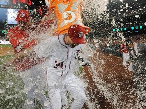Washington Nationals starting pitcher Max Scherzer is doused with water after striking out 20 batters against the Detroit Tigers at Nationals Park in Washington on May 11, 2016. (Brad Mills/USA TODAY Sports)