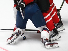 Canada's Brad Marchand (63) challenges Kyle Connor of the United States (bottom) during world hockey championship action in St. Petersburg, Russia, on Friday, May 6, 2016. (Dmitri Lovetsky/AP Photo)