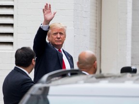 Republican presidential candidate Donald Trump waves as he arrives for a meeting with House Speaker Paul Ryan at the Republican National Committee Headquarters on Capitol Hill in Washington, on May 12, 2016. (AP Photo/Andrew Harnik)
