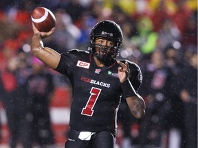 Redblacks quarterback Henry Burris wears the former home jersey during a 2015 game against the Blue Bombers at TD Place stadium in Ottawa. (Jean Levac/Postmedia)