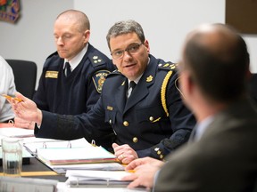 London Police chief John Pare answers a question from mayor Matt Brown during a discussion about the policing budget during a Police Services Board meeting at police headquarters on Dundas Street in London, Ont. on Thursday February 25, 2016. (CRAIG GLOVER, Free Press file photo)