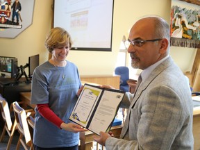 Jason Miller/The Intelligencer
Anne Mackinnon is recognized by Mayor Taso Christopher for her volunteer commitment to the Belleville Waterfront and Ethnic Festival.A press conference at city hall Thursday highlighted this year’s festival.