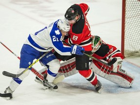 Toronto Marlies Ben Smith and Albany Devils Dan Kelly in action at Ricoh Coliseum on May 4, 2016. (Ernest Doroszuk/Toronto Sun)