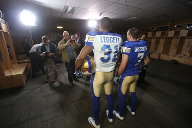 The CFL Winnipeg Blue Bombers staged a photo opportunity today, to display team jerseys.  The players wearing the jerseys are;  Maurice Leggett (left)and, Weston Dressler.   Thursday, May 12, 2016.   Sun/Postmedia Network