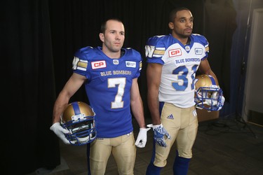 The Winnipeg Blue Bombers showed off their new jerseys Thursday, May 12, 2016, with the help of Weston Dressler (left), and Maurice Leggett.