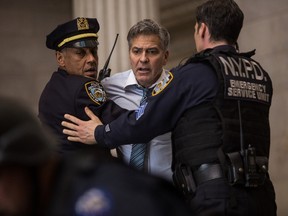 This image released by Sony Pictures shows George Clooney in a scene from "Money Monster," opening in theaters nationwide on May 13. (Atsushi Nishijima/TriStar Pictures-Sony Pictures via AP)