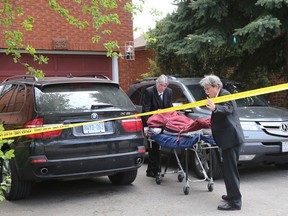 A body is removed from 33 Cameron Ave. in North York Thursday, May 12, 2016. (Michael Peake/Toronto Sun)