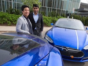 E1 Transit founders Han Yi and Gary Rodrigues with two of their transit company?s Tesla Model S electric cars, which cost as much as a small house. (Craig Glover/The London Free Press)