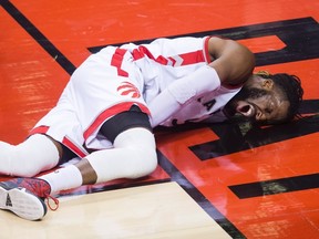 Toronto Raptors forward DeMarre Carroll screams in pain after injuring himself while playing against the Miami Heat in Toronto on May 11, 2016. (THE CANADIAN PRESS/Nathan Denette)