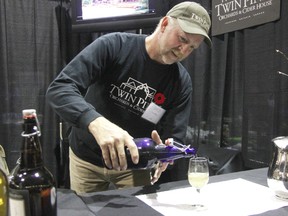 In this file photo, Mark Vansteenkiste pours a glass of Twin Pines Orchard and Cider House cider at the Fusion food and wine show. Twin Pines recently won two gold medals at the Great Lakes International Cider and Perry Competition.
File photo/ THE OBSERVER