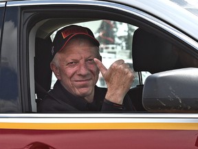 LAC LA BICHE, ALTA: MAY 12, 2016 -- Fort McMurray Fire Chief Darby Allen gives a thumbs up after giving an operational update and to announce he will no longer be in charge of the fire, to media at an RCMP checkpoint about 8 km south of Fort McMurray, May 12, 2016. (ED KAISER/PHOTOGRAPHER)