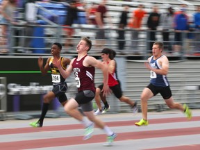 Ethan Martin of South just beats Adrian Livingston of Mgsr. Gruyere in the junior boys 100m sprint  at the TVRA Central track and field championship at Western in London, Ont. on Thursday May 12, 2016. Mike Hensen/The London Free Press/Postmedia Networkin London, Ont. on Thursday May 12, 2016. Mike Hensen/The London Free Press/Postmedia Network