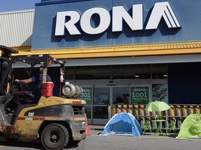 A man drives a forklift in front of a Rona home improvement store in St. Eustache, Que., just outside Montreal, on Thursday, July 16, 2015. THE CANADIAN PRESS/Ryan Remiorz