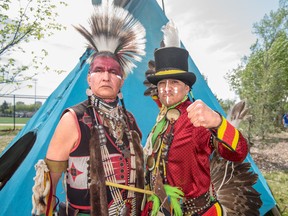 Donny and Dougie Rain from Paul First Nation pose for a portrait during the 33rd Annual Ben Calf Robe Traditional Powwow at the Commonwealth Stadium in Edmonton on Saturday, May 7, 2016. The Rains are radio hosts for CFWE radio program Heartbeat of Nations. - Photo by Yasmin Mayne