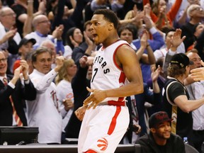 Kyle Lowry celebrates a 3 pointer late in the 4th quarter as the Toronto Raptors beat the Miami Heat in game 5 of the best of 7 series  in Toronto, Ont. on Wednesday May 11, 2016. Stan Behal/Toronto Sun