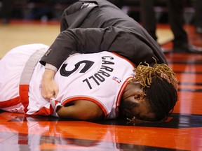 DeMarre Carroll lands badly in the 3rd quarter but the Toronto Raptors go on to beat the Miami Heat in game 5 of the best of 7 series  in Toronto, Ont. on Wednesday May 11, 2016. Stan Behal/Toronto Sun
