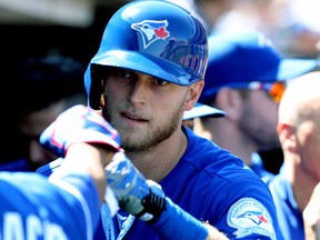 Toronto Blue Jays outfielder Michael Saunders is greeted in the dugout after his solo home run in the ninth inning against the San Francisco Giants at AT&T Park in San Francisco on May 11, 2016. (Lance Iversen/USA TODAY Sports)
