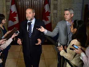 NDP Leader Tom Mulcair speaks to reporters following a caucus meeting on Parliament Hill in Ottawa on Wednesday, May 11, 2016. A Federal Court hearing is taking place today in Montreal on the NDP satellite office controversy, which has bedevilled the party since long before Mulcair's unsuccessful bid to become prime minister. THE CANADIAN PRESS/Sean Kilpatrick