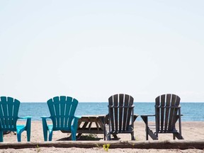 Erieau, surrounded by water, is a place to sit and watch the world go by. Visitors can expect warm water, a long sandy beach and opportunitues for shopping, dining and water sports. File photo/Postmedia Network