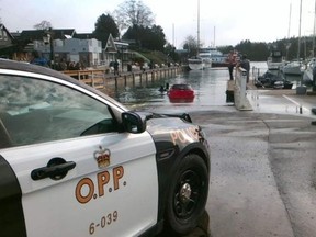 A car is towed from the harbour at Tobermory, Ont. (PHOTO SUPPLIED BY THE BRUCE PENINSULA OPP)