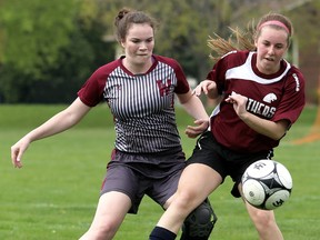 Wallaceburg Tartans' Kaitlyn Quinlan, left, and McGregor Panthers' Hannah Doforno battle for the ball in the first half of their LKSSAA senior girls soccer game Thursday at McGregor. (MARK MALONE/The Daily News)