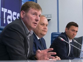 Bobsled champion Alexander Zubkov (left) speaks at a news conference as Deputy Sports Minister Yuri Nagorny (centre) and cross-country skier Alexander Legkov (right) listen in Moscow on Friday, May 13, 2016. Two Olympic gold medalists from Russia, Zubkov and Legkov, denied doping claims a day after they were named in a newspaper report detailing state-sponsored cheating at the 2014 Sochi Games. (Alexander Zemlianichenko/AP Photo)