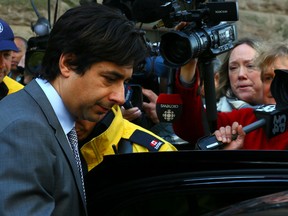 Jian Ghomeshi leaves at Old City Hall Courts in Toronto on Wednesday May 11, 2016. Dave Abel/Toronto Sun/Postmedia Network