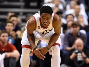 DeMar DeRozan holds his injured thumb during Game 5. (Frank Gunn/CP)