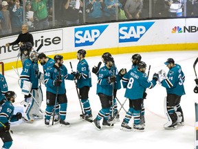 Sharks centres Joe Pavelski (8) and Patrick Marleau (12), goalie James Reimer (34) and teammates congratulate each other after the end of Game 7 against the Predators of the second round NHL playoff series in San Jose on Thursday, May 12, 2016. (Neville E. Guard/USA TODAY Sports)