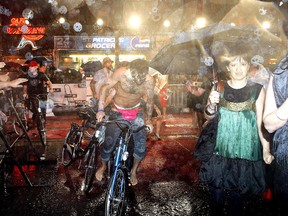 Hedley takes shelter in heavy rain during red carpet arrivals along Queen St.  for the Much Music Video Awards in June  2008 — the year with the wettest summer on record. (DAVE ABEL, Toronto Sun)